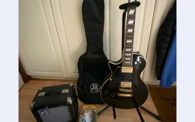 Electronic guitar in hillcrest for sell.it goes with amp,sx guitar bag,stand,wall mounted bracket, sx guitar power dvd.still in original form