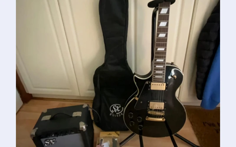 Left handed stagg electric guitar in  ridge for sell.it includes AMP,SX guitar bag,stand ,wall mounted bracket. and many others