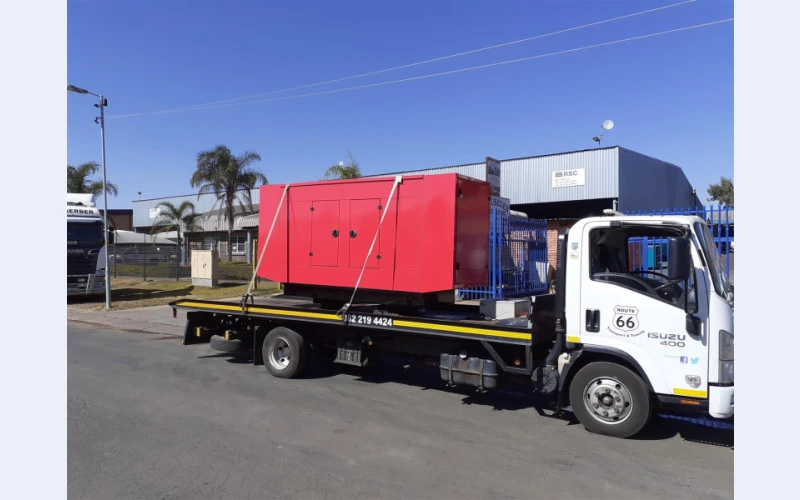 Generator Transport with flatbed rollback truck
